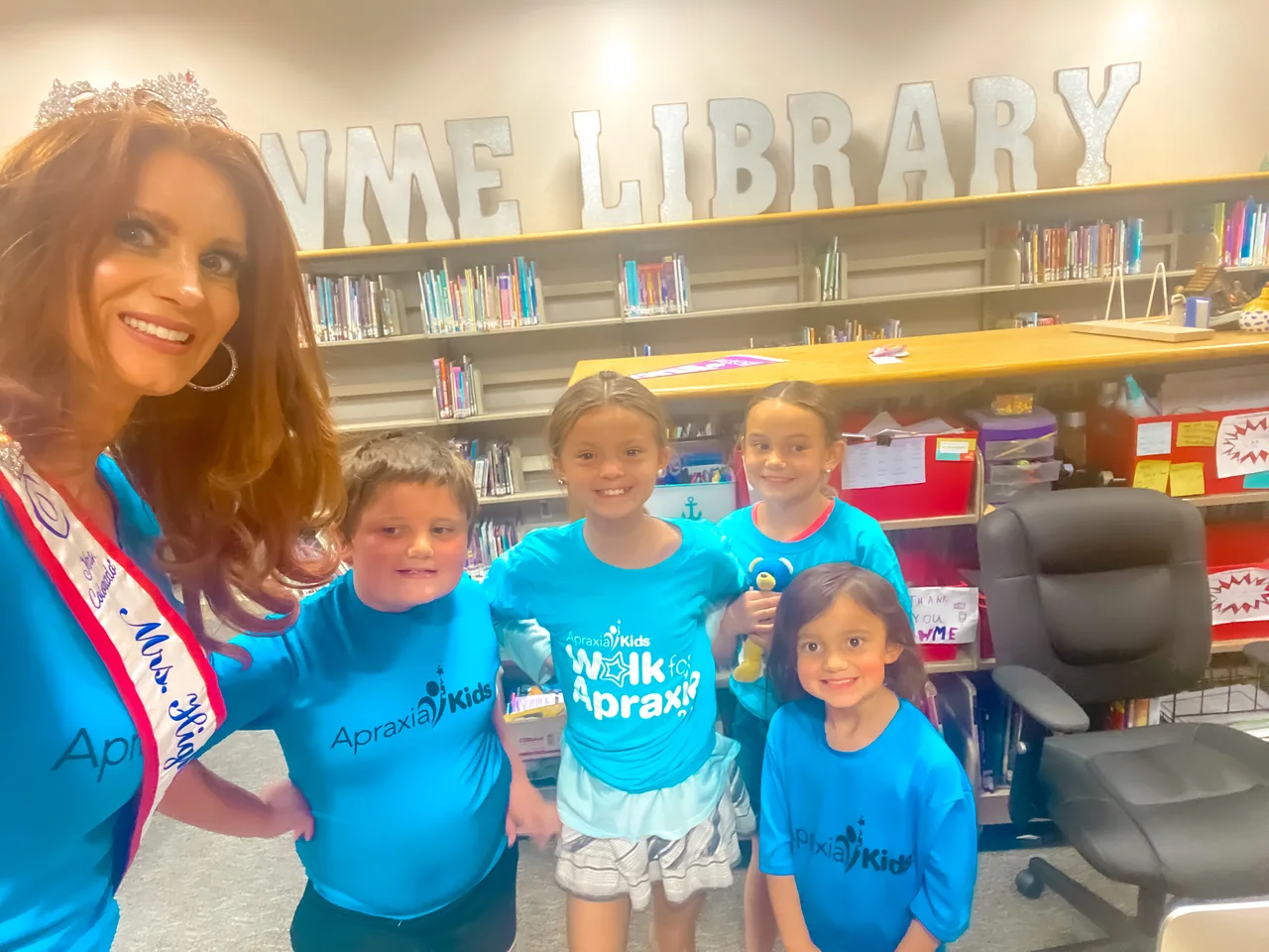 AJ with young readers in a library